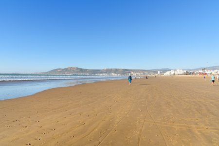 Agadir. Morocco - December 23, 2016: Long, wide beach in Agadir city, Morocco. The hill bears the inscription in Arabic: "God, Country, King"のeditorial素材