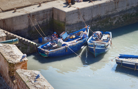 Essaouira, Morocco - December 31, 2016: Blue wooden fishing boats in portのeditorial素材