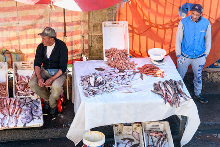 Essaouira, Morocco - December 31, 2016: Moroccan local men sell fresh fish and seafood on the market in portのeditorial素材