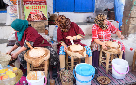 Essaouira, Morocco - January 01, 2017: Moroccan women make argan oil on the market in medinaのeditorial素材