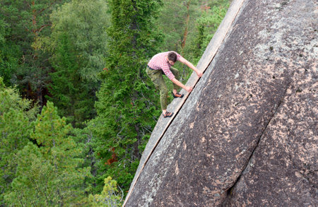 Krasnoyarsk, Russia- August 10, 2017: Unidentified Climber climbs on the rock wall. Pillar the Fourth. Central pillars of Russian reserve Stolby Nature Sanctuaryのeditorial素材