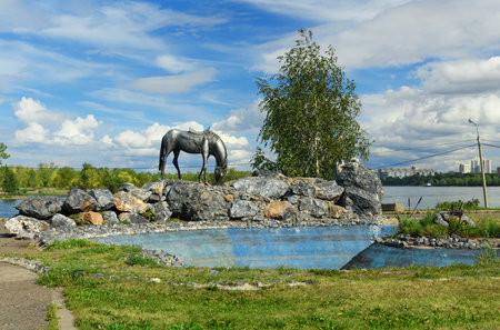 Krasnoyarsk, Russia- August 9, 2017: Iron sculpture White Horse on embankment of Yenisei riverのeditorial素材