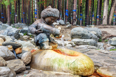 Arshan, Russia - August 16, 2017: Source of mineral water. Water flows from form of figures of boy with jug. Buryatiaのeditorial素材