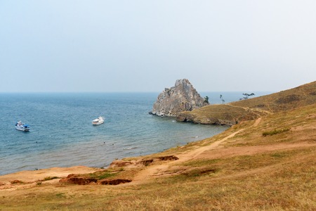 View of Shaman Rock in the overcast. Lake Baikal. Olkhon Island. Russiaの写真素材