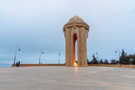 Baku, Azerbaijan - March 11, 2018: Shahidlar Monument or Eternal flame Monument on Martyrs' Lane in the eveningのeditorial素材