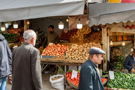 Tabriz, East Azerbaijan province, Iran - March 15, 2018: People on the fruct street bazaar. Tabriz Grand Bazaar is one of the oldest bazaars in the Middle Eastのeditorial素材