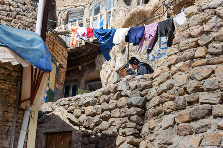 Kandovan, East Azerbaijan province, Iran - March 16, 2018: Clothes hanging near house in rock village Kandovanのeditorial素材