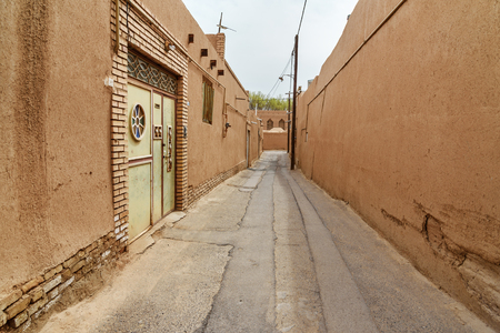 Narrow street with of old adobe Yazd city. Iranの写真素材