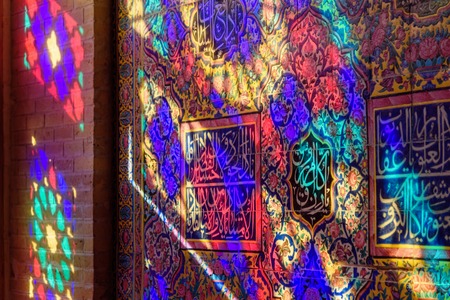 Colorful light from stained glass window on the wall of Nasir Ol-Molk mosque, also famous as Pink Mosque in morning. Shiraz. Iranの写真素材