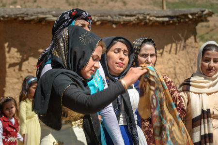 Lorestan Province, Iran - April 1, 2018: Iranian women dancing Lurish Cupi dances on wedding ceremony in the village.のeditorial素材