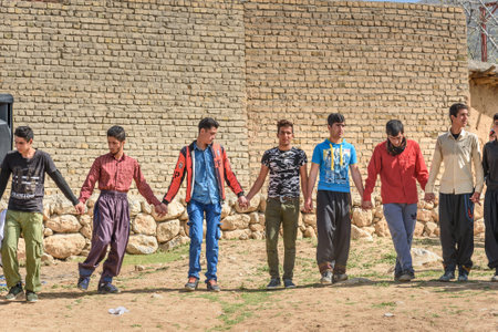 Lorestan Province, Iran - April 1, 2018: Iranian men dancing Lurish Cupi dances on wedding ceremony...