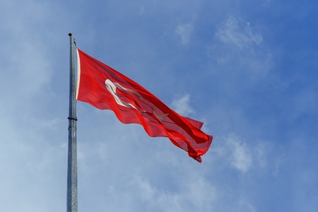 Turkish flag waving on blue sky background
