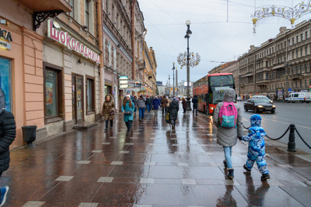 Saint Petersburg, Russia - January 4, 2018: People on Nevsky Prospect is the main street of the city in rainyのeditorial素材