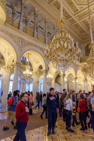 Saint Petersburg, Russia - January 3, 2018:Tourists in the Field Marshals' Room of State Hermitage...
