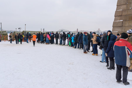 Saint Petersburg. Russia - January 12, 2018: Group of people standing in the queue to Ice-hole for...