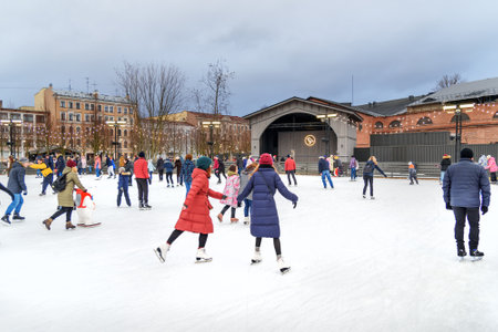 Saint Petersburg, Russia - January 2, 2018: People skate at ice rink in New Holland park in the winterのeditorial素材