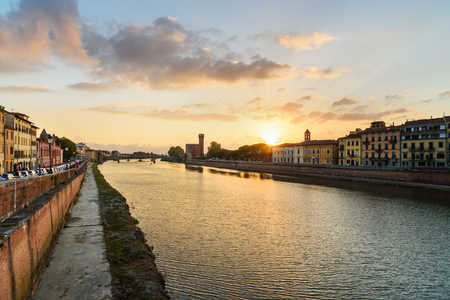 View on embankment of Arno river at sunset in Pisa, Italyの写真素材