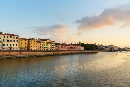 View on embankment of Arno river at sunset in Pisa, Italyの写真素材