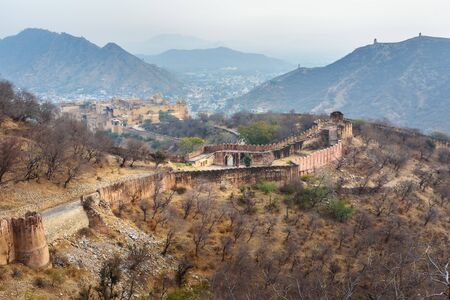 Ancient long wall with towers around Amber Fort. Jaipur. Rajasthan. India