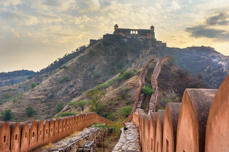 Ancient long wall with towers around Amber Fort, and view of Jaigarh Fort. Jaipur. Rajasthan. Indiaのeditorial素材