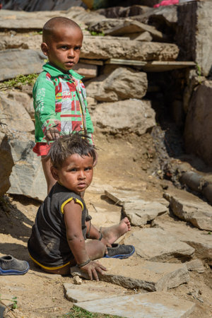 Sambhar, India - February 03, 2019: India children sitting on the street in Sambhar Lake Village. Rajasthanのeditorial素材