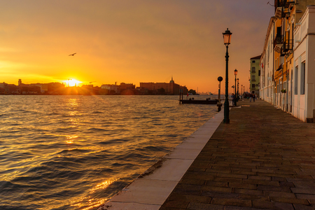 Fondamenta Zattere Allo Spirito and Venetian Lagoon on sunset in Venice. Italyの写真素材