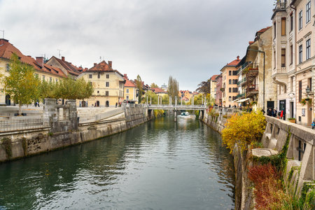 Ljubljana, Slovenia - October 26, 2018: View of Ljubljanica river and Cobblers' Bridge or the Shoemakers' Bridge in Ljubljanaのeditorial素材
