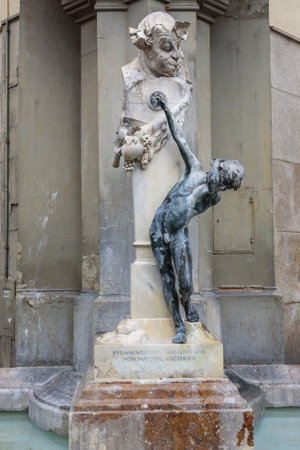 Munich, Germany - October 31, 2018: Fountain Brunnenbuberl or Boy in old city of Munichのeditorial素材