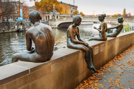Berlin, Germany - November 08, 2018: Sculpture Bathers on the Spree, Three Girls and a Boy by Wilfried Fitzenreiter were made from 1977-1979のeditorial素材
