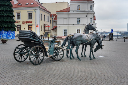 Minsk, Belarus - November 15, 2018: Sculpture The Carriage by belorussian sculptor Vladimir Zhbanov 2004 on Freedom Square in Upper Town in historical centerのeditorial素材