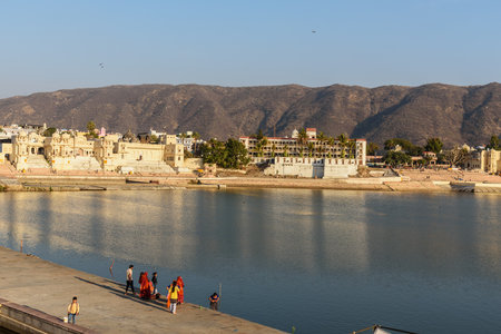 Pushkar, India - February 06, 2019: Indian people bathing in Pushkar holy lake in Rajasthan