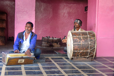 Deshnok, India - February 11, 2019: Indian men playing the drum and Harmonium in Karni Mata Temple or Rats Temple in Deshnok. Rajasthanのeditorial素材