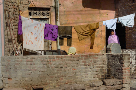 Bikaner, India - February 12, 2019: Dry clothes on the street in old town of Bikaner. Rajasthanのeditorial素材
