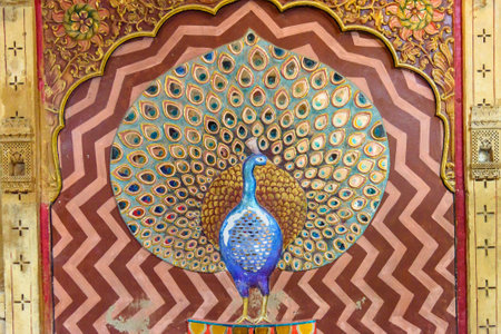 Jaisalmer, India - February 13, 2019: Peacock made of molten glass and mirrors on wall of Patwon ki Haveli palace in Jaisalmer. Rajasthanのeditorial素材