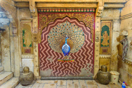 Jaisalmer, India - February 13, 2019: Peacock made of molten glass and mirrors on wall of Patwon ki Haveli palace in Jaisalmer. Rajasthanのeditorial素材