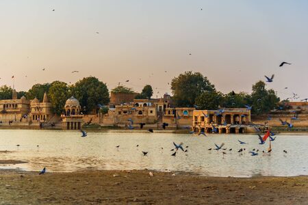 Gadisar lake on sunset. Man-made water reservoir with temples in Jaisalmer. Rajasthan. India