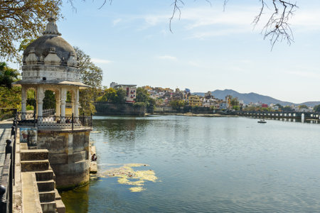 Udaipur, India - February 17, 2019: Walking Track park on Swaroop Sagar Lake is artificially created lake. It combined water body comprising other nearby lakes Fateh Sagar Lake and Lake Picholaのeditorial素材
