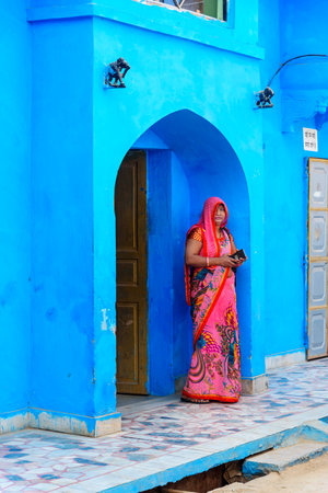 Bundi, India - February 19, 2019: Indian woman near arch on the street in Bundi. Rajasthanのeditorial素材
