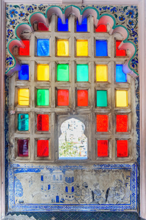 Colorful mosaic window of City palace in Udaipur. Rajasthan. Indiaのeditorial素材