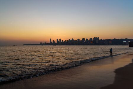 Sunset on Chowpatty beach. View of Malabar hill in Mumbai. Indiaの写真素材