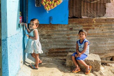Mumbai, India - February 26, 2019: Indian children at the store near Suburban Railway in Dharavi Slumのeditorial素材