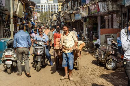 Mumbai, India - February 26, 2019: On the street in Dharavi Slum at Mumbaiのeditorial素材