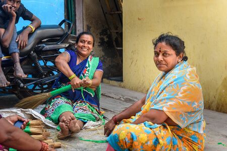 Mumbai, India - February 26, 2019: Indian women making brooms in Dharavi Slum at Mumbaiのeditorial素材