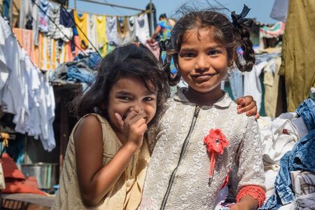 Mumbai, India - February 27, 2019: Indian young girls in Mahalaxmi Dhobi Ghat is outdoor laundry in...