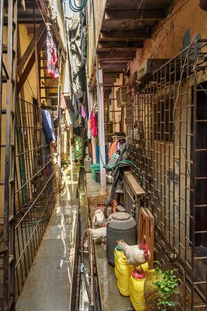 Mumbai, India - February 26, 2019: On the narrow street in Dharavi Slum at Mumbaiのeditorial素材
