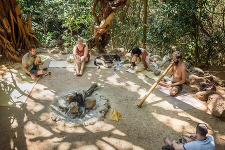 Arambol, India - March 02, 2019: People under big banyan tree in Arambolのeditorial素材