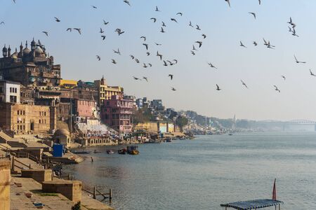 Varanasi, India - March 16, 2019: Morning view of Ganges river and Panchganga Ghat