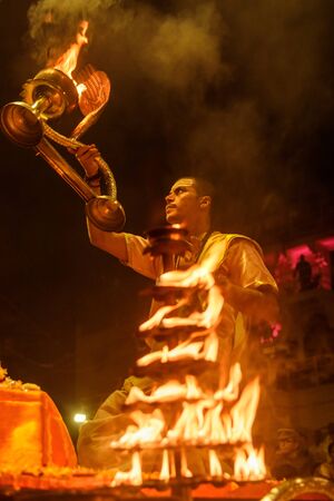 Varanasi, India - March 15, 2019: Ganga aarti ceremony rituals at Dashashwamedh Ghat in Varanasiのeditorial素材