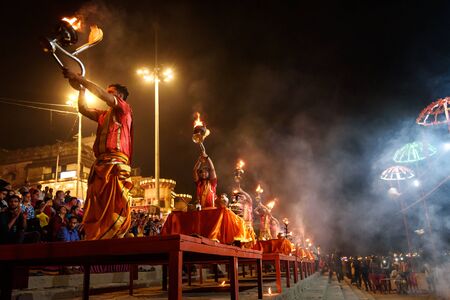 Varanasi, India - March 16, 2019: Ganga aarti ceremony rituals at Assi Ghat in Varanasi