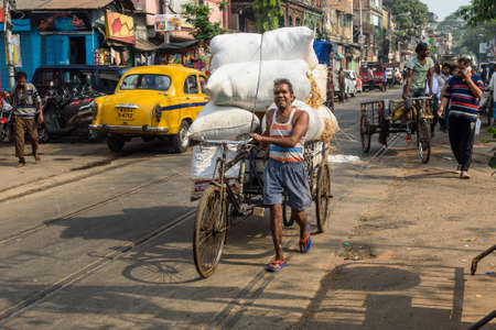 Kolkata, India - March 12, 2019: Cargo cycle rickshaw on the road in Kolkataのeditorial素材